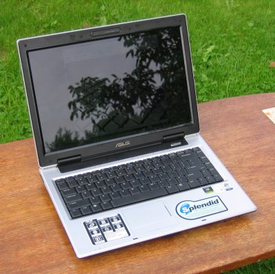 The screen is very reflective. Outside, this laptop is only useful to look at the clouds, but this photo is maybe not so good to illustrate this. Yes, the screen is turned on.<br />The two big (imho ugly) stickers, don't stick so well after using the laptop for a while because your wrists are constantly laying on and moving over the stickers. After a while (5 months?) I noticed that I could easily pull them off cleanly. omg, I'm good at talking about details :)